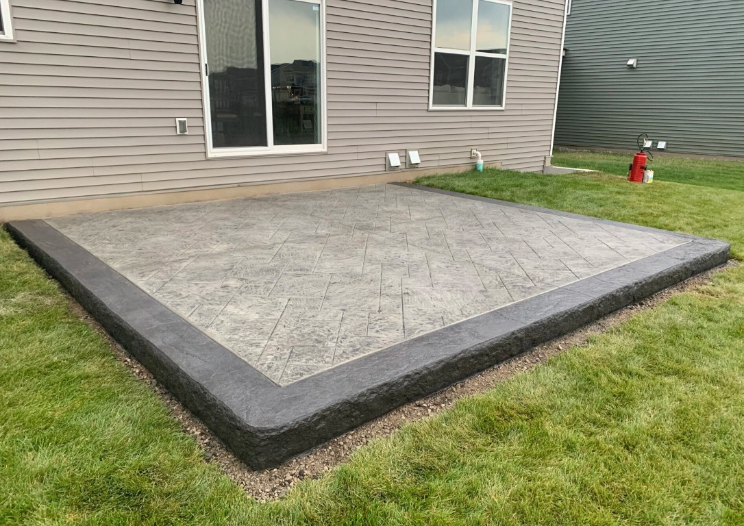 High-quality finished concrete patio with professional borders in Decatur, IL