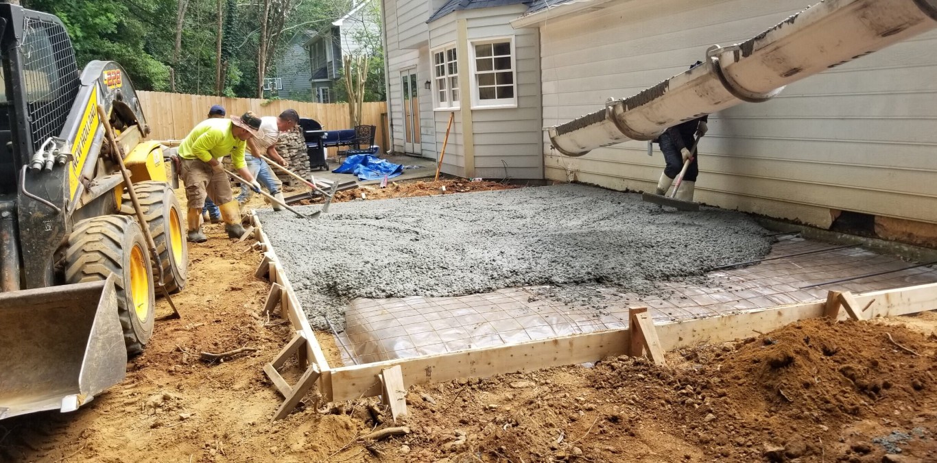 Proper concrete base preparation and grading for long-lasting driveways in Decatur, IL
